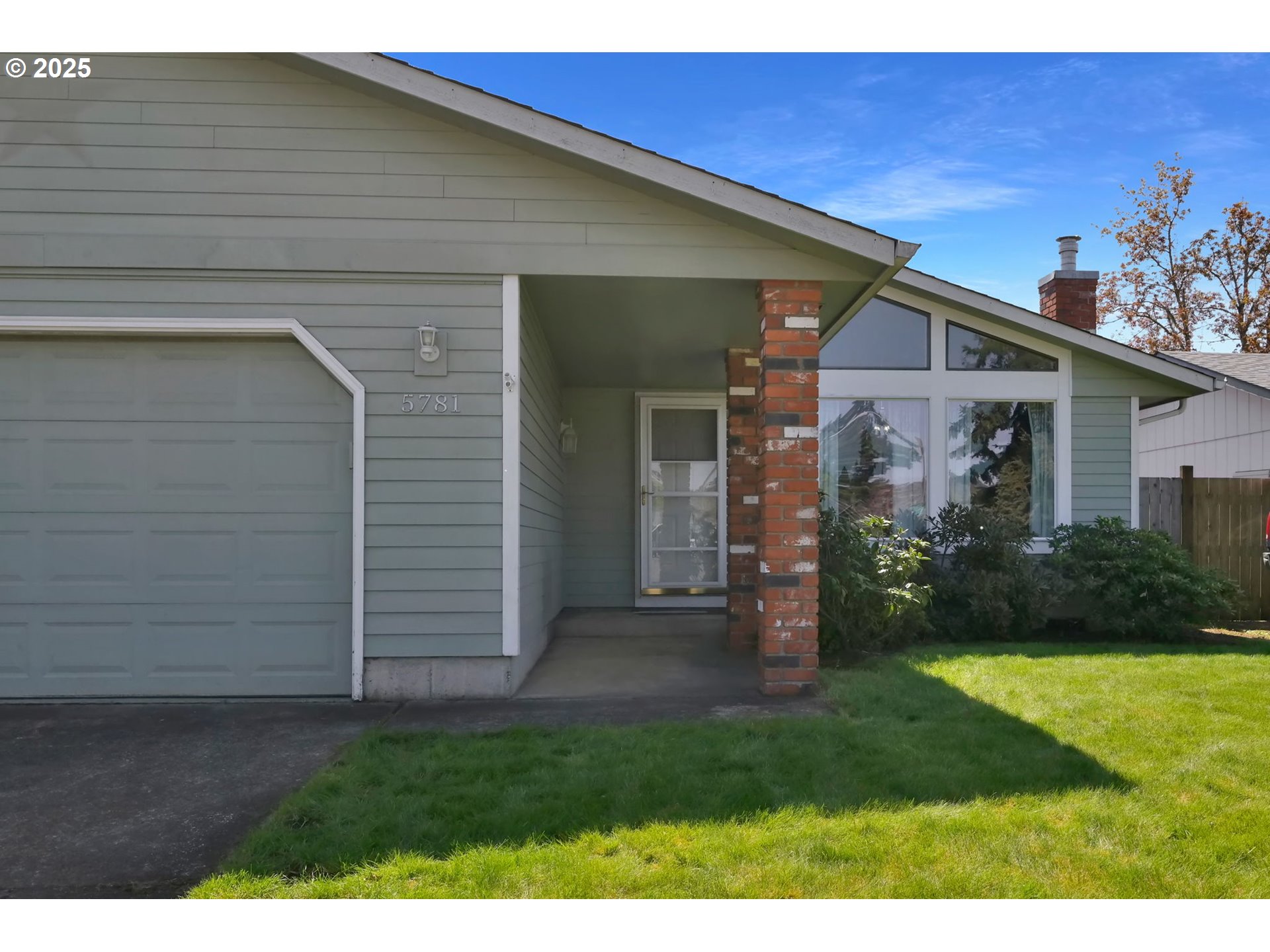5781 E Street Springfield, OR 97478 - Photo 3 of 36 a front view of a house with garden