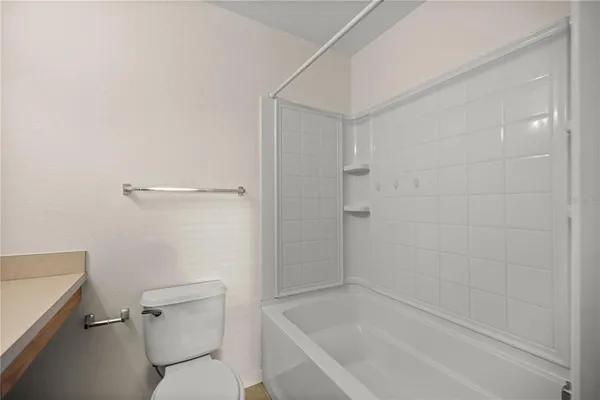 a bathroom with a sink toilet and a mirror