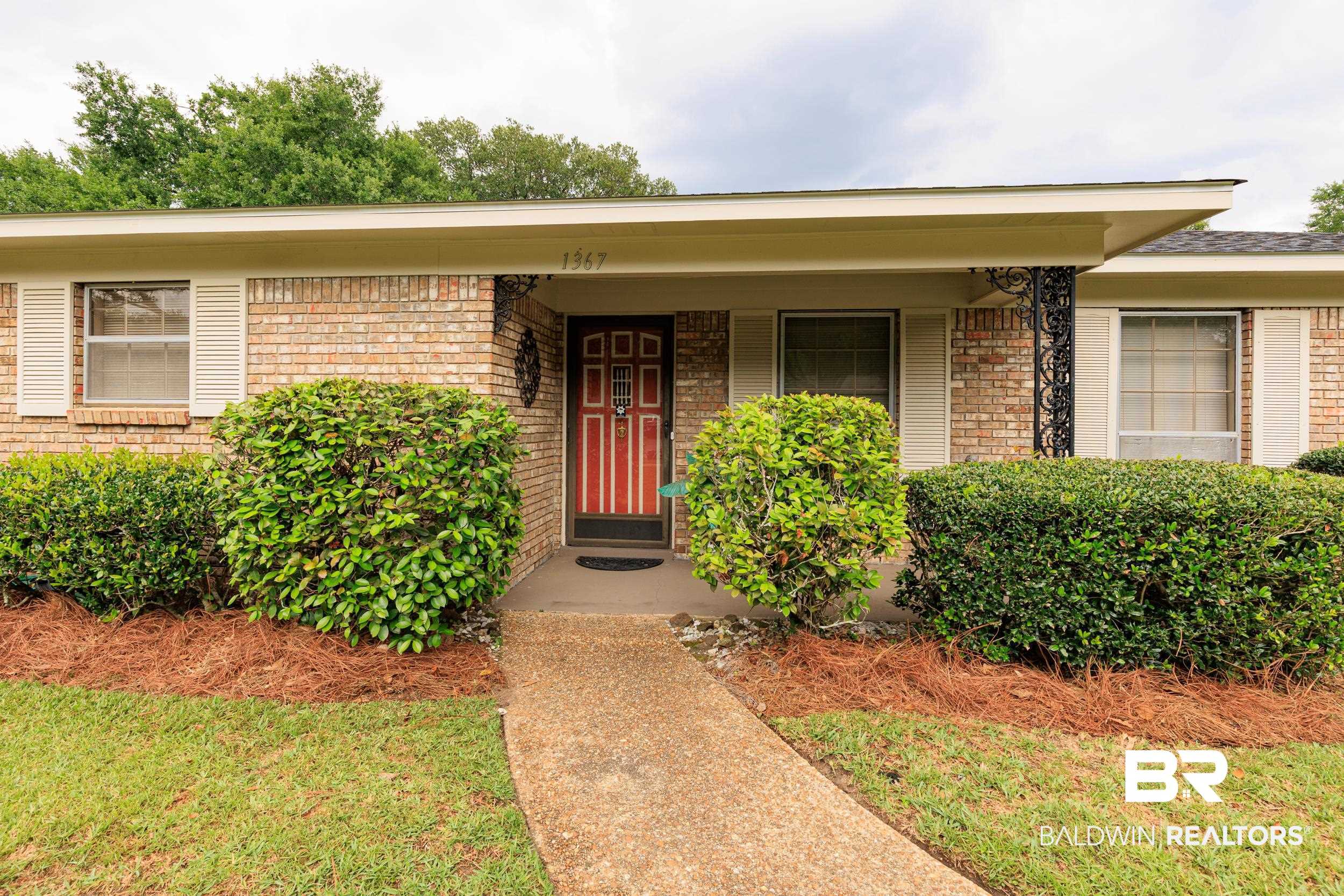 1367 Spring Valley Court Mobile, AL 36693 - Photo 23 of 29 Brick exterior with a covered entry and a red paneled front door