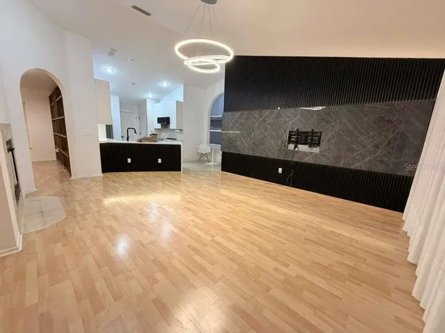 a view of a kitchen with a sink and cabinets
