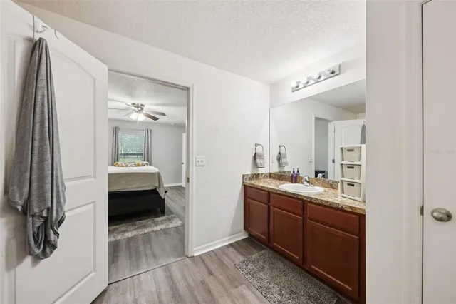 a kitchen with a sink and a stove top oven
