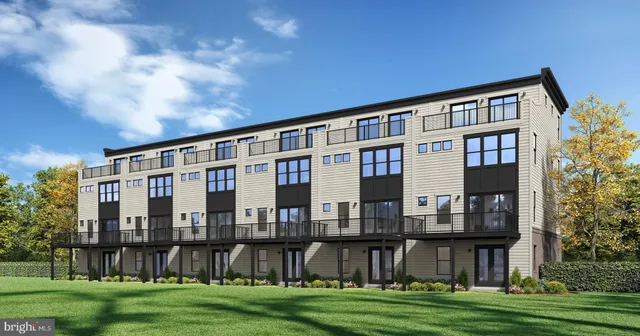 a front view of a building with a yard