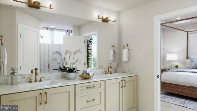 a en suite bathroom with double sink and a mirror