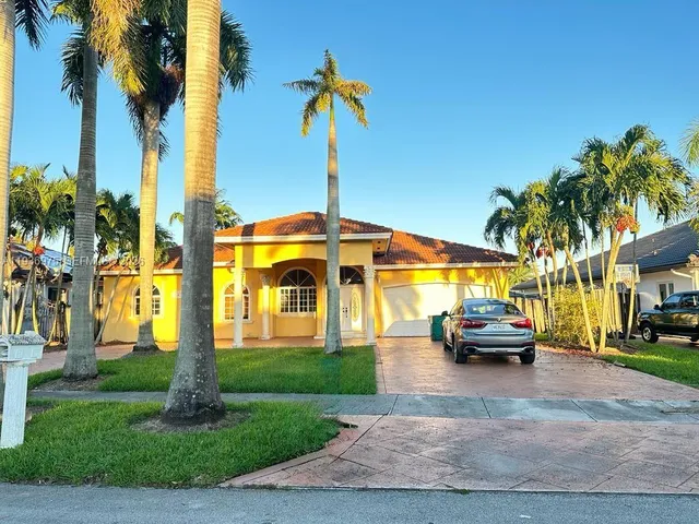 a parked cars parked in front of a house