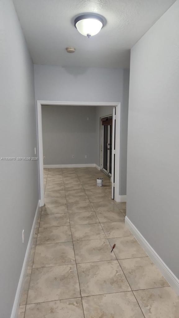 3187 Southwest 143rd Place Miami, FL 33175 - Photo 14 of 22 an empty room with a natural light