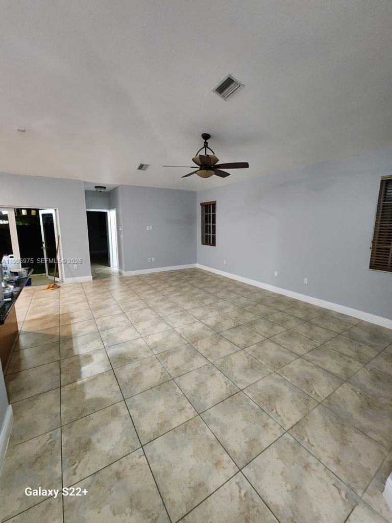3187 Southwest 143rd Place Miami, FL 33175 - Photo 5 of 22 a view of a livingroom with a staircase