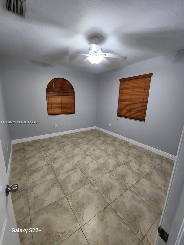 3187 Southwest 143rd Place Miami, FL 33175 - Photo 6 of 22 an empty room with a window