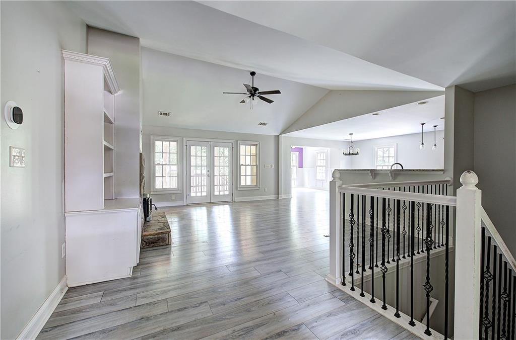 561 Holland Road Dallas, GA 30157 - Photo 4 of 48 a view of a room with wooden floor and stairs