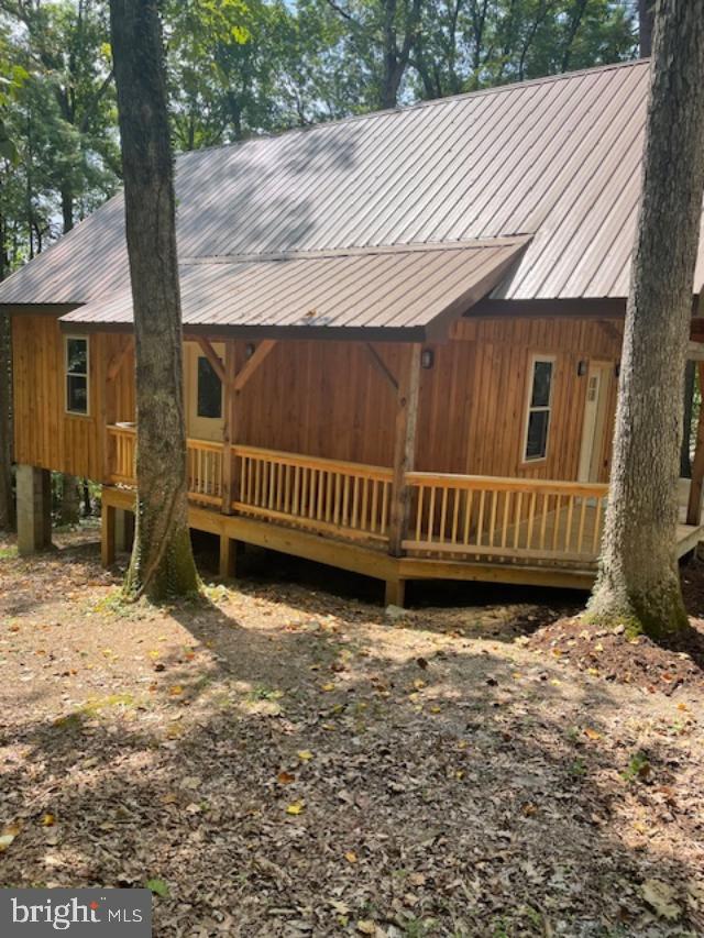 1373 Jacks Mountain Road McVeytown, PA 17051 - Photo 2 of 11 a view of a backyard with a small cabin and chair
