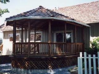 8904 Ross Station Road Sebastopol, CA 95472 - Photo 2 of 3 a view of house with wooden deck and furniture