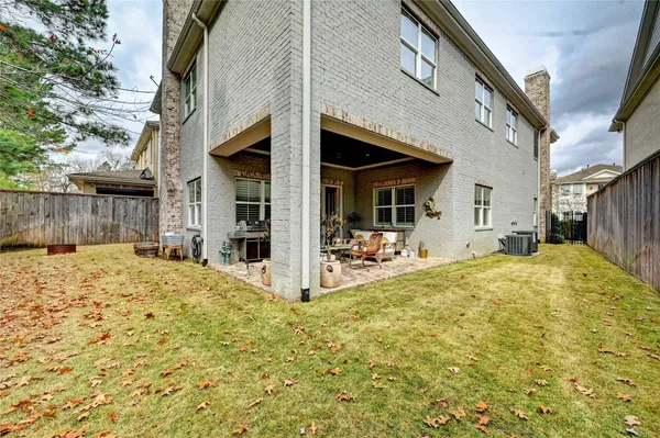 a view of a house with wooden fence