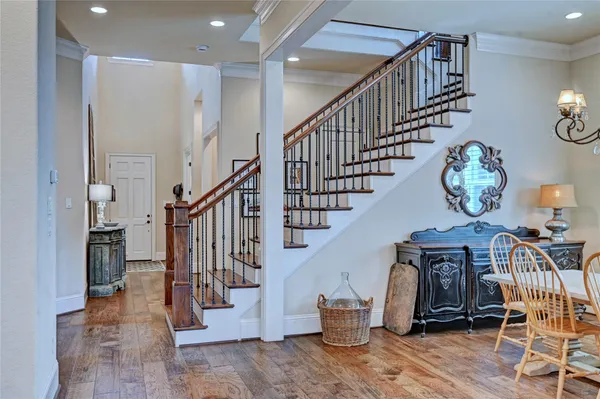 a view of entryway livingroom and hall with wooden floor