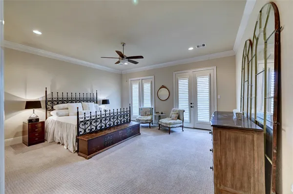 a bed room with a bed and a chair