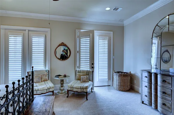 a living room with furniture a air conditioner vent and a window