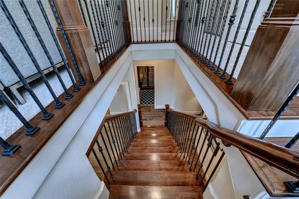 a view of entryway with wooden floor and stairs
