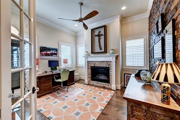 a living room with furniture fireplace and window