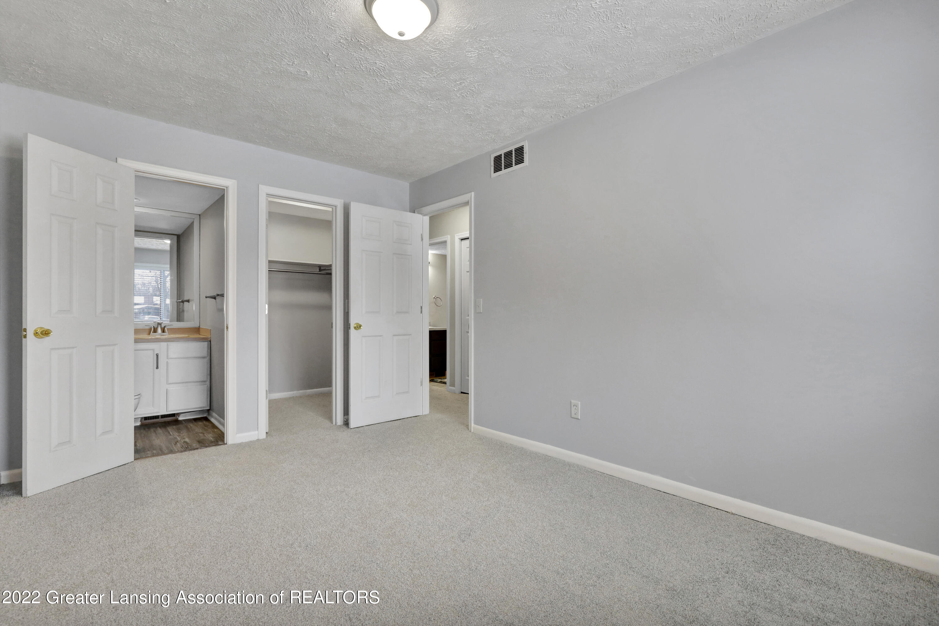 205 East Jolly Road, Unit A5 Lansing, MI 48910 - Photo 13 of 29 Primary Bedroom