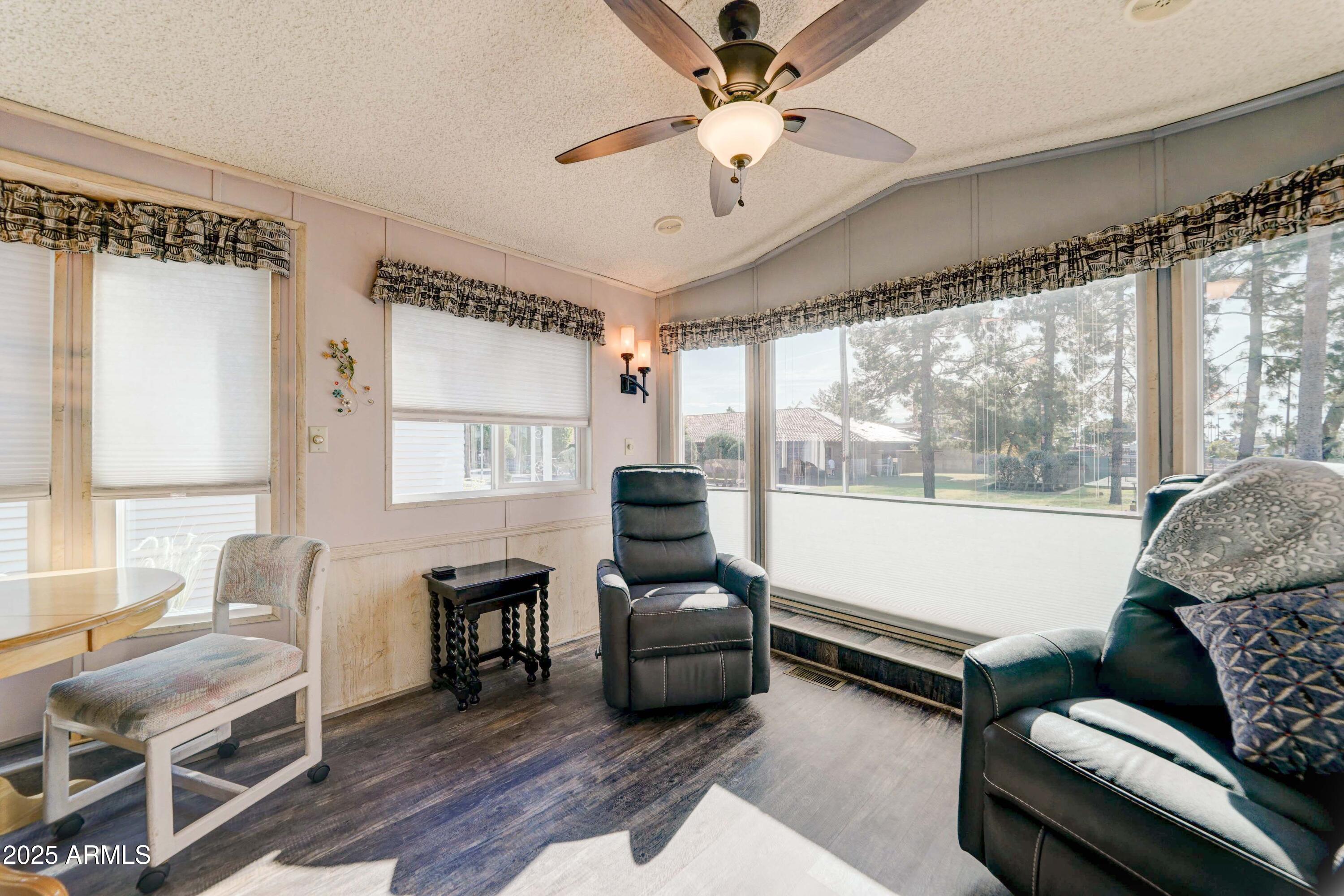 111 South Greenfield Road, Unit 633 Mesa, AZ 85206 - Photo 22 of 32 a living room with furniture and a large window