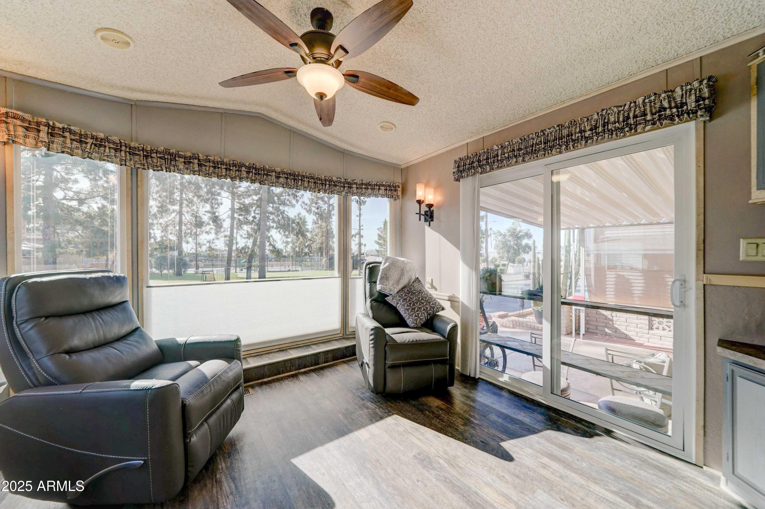 111 South Greenfield Road, Unit 633 Mesa, AZ 85206 - Photo 23 of 32 a living room with furniture and a large window