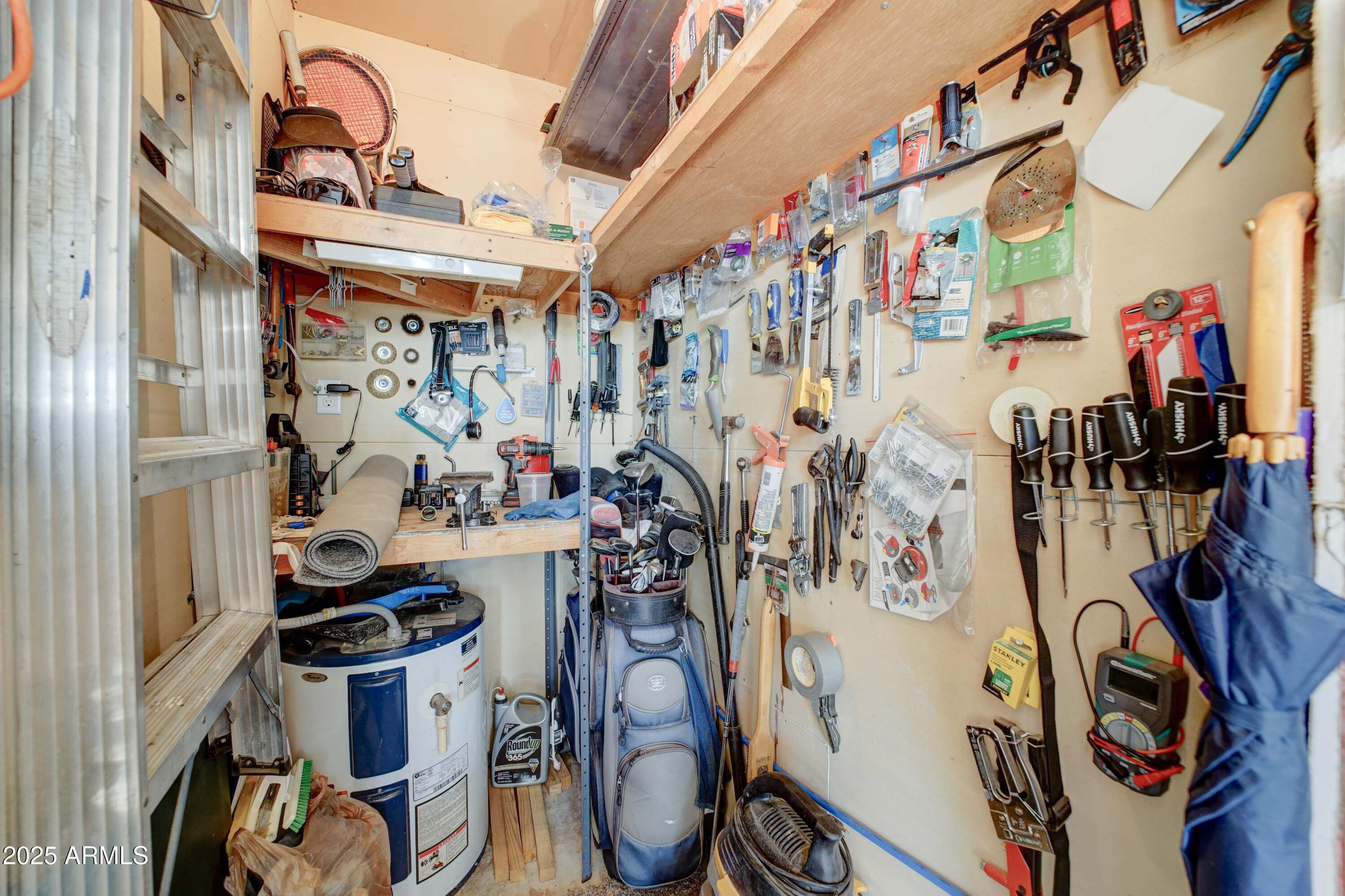 111 South Greenfield Road, Unit 633 Mesa, AZ 85206 - Photo 24 of 32 a view of walk in closet with clothes