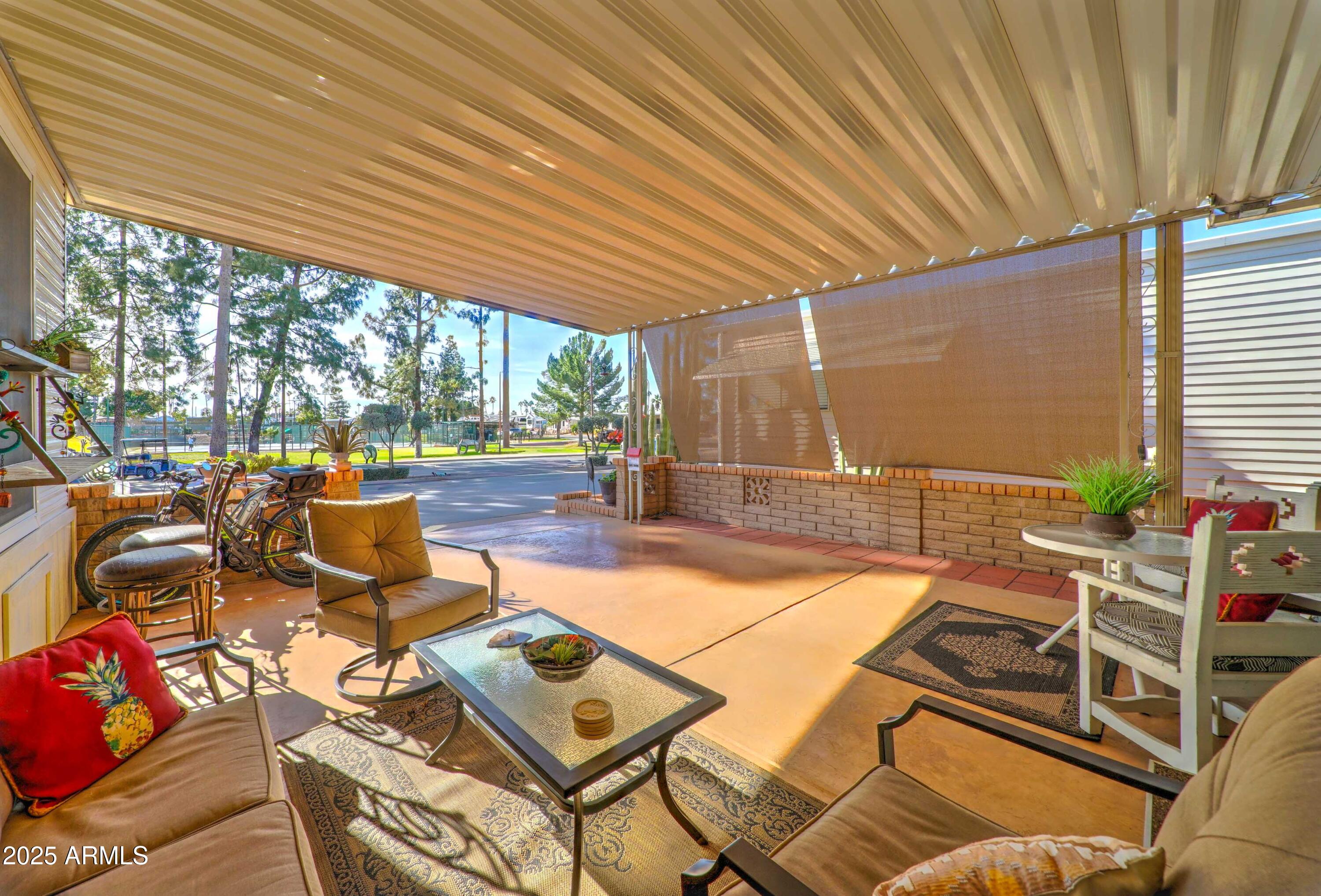 111 South Greenfield Road, Unit 633 Mesa, AZ 85206 - Photo 4 of 32 a outdoor space with patio lots of furniture
