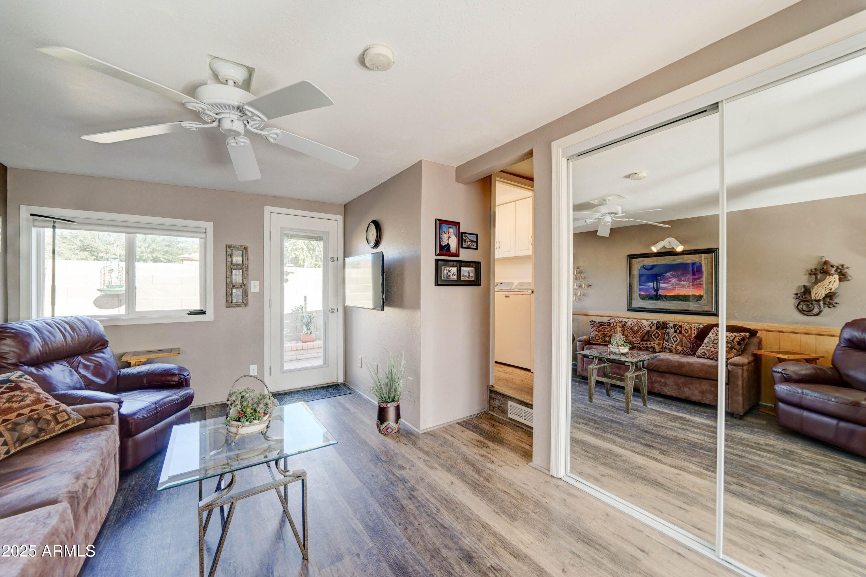 111 South Greenfield Road, Unit 633 Mesa, AZ 85206 - Photo 5 of 32 a living room with furniture and wooden floor