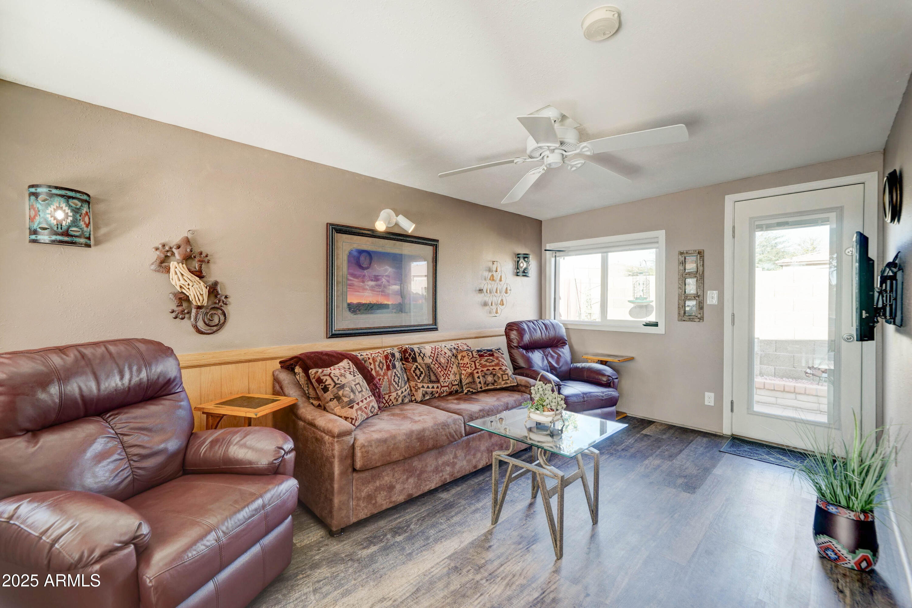 111 South Greenfield Road, Unit 633 Mesa, AZ 85206 - Photo 7 of 32 a living room with furniture and wooden floor