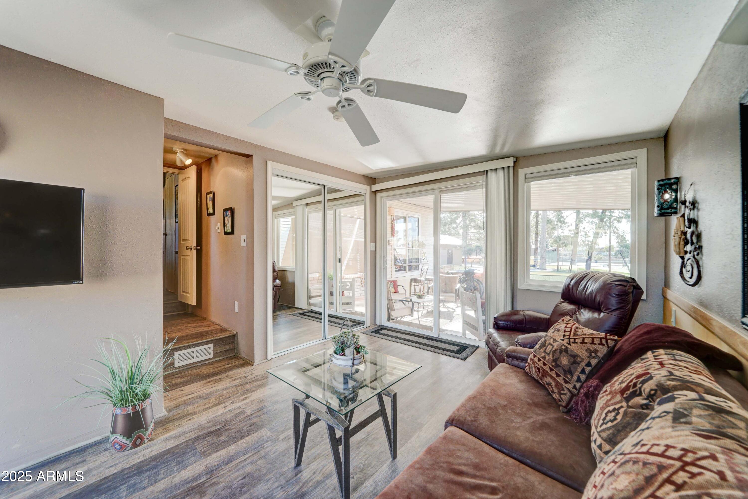 111 South Greenfield Road, Unit 633 Mesa, AZ 85206 - Photo 8 of 32 a living room with furniture and a flat screen tv