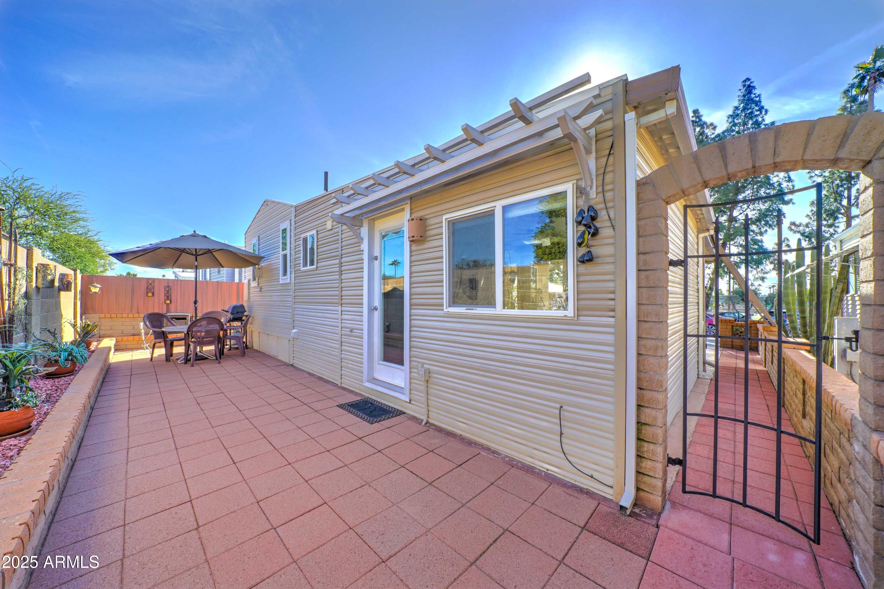 111 South Greenfield Road, Unit 633 Mesa, AZ 85206 - Photo 10 of 32 a view of a house with a patio