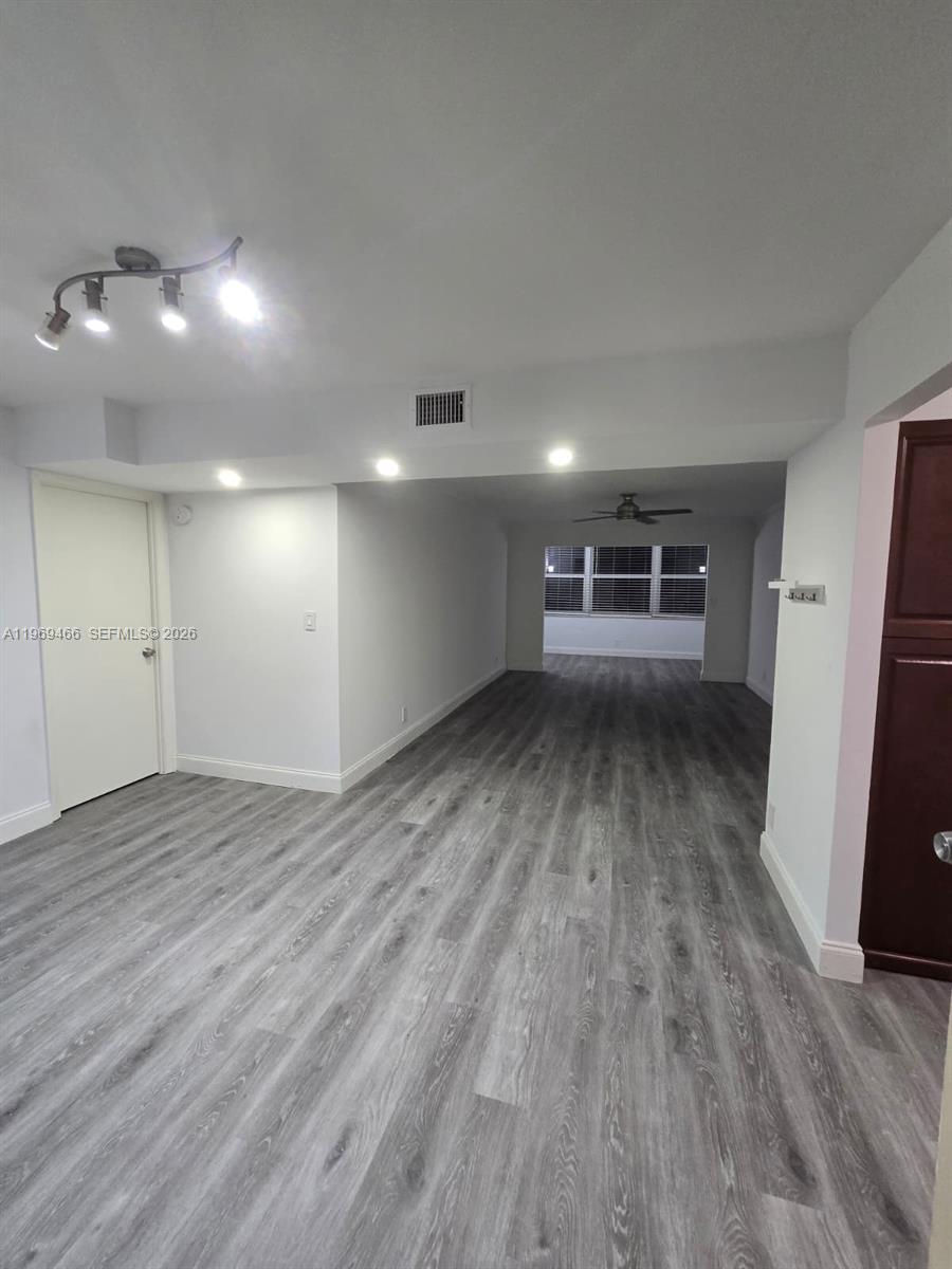 6500 Cypress Road, Unit 301 Plantation, FL 33317 - Photo 3 of 15 a view of empty room with wooden floor