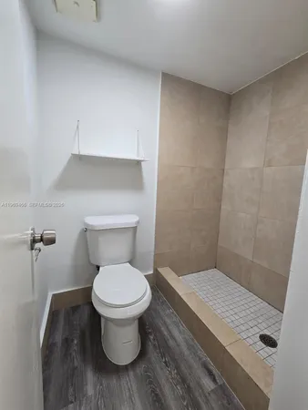 a bathroom with a toilet and a sink