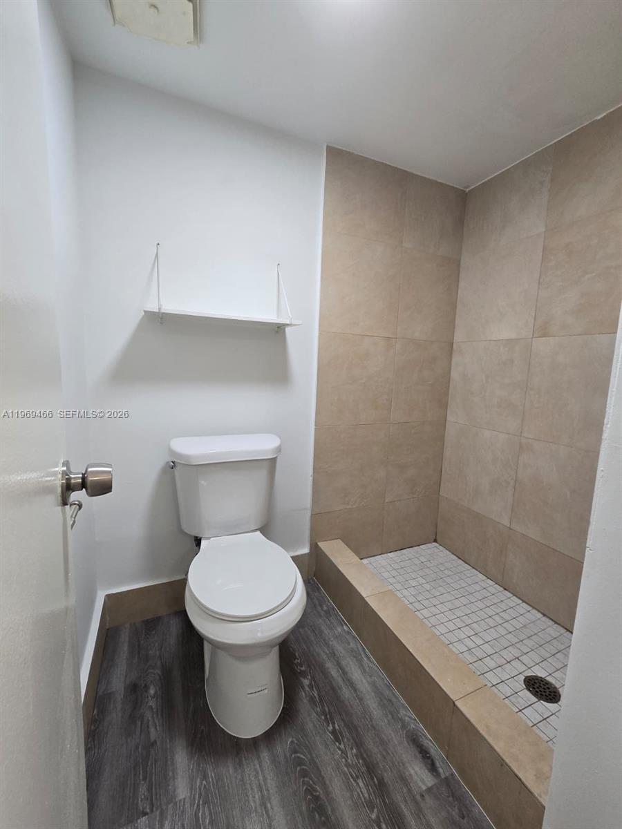 6500 Cypress Road, Unit 301 Plantation, FL 33317 - Photo 9 of 15 a bathroom with a toilet and a sink