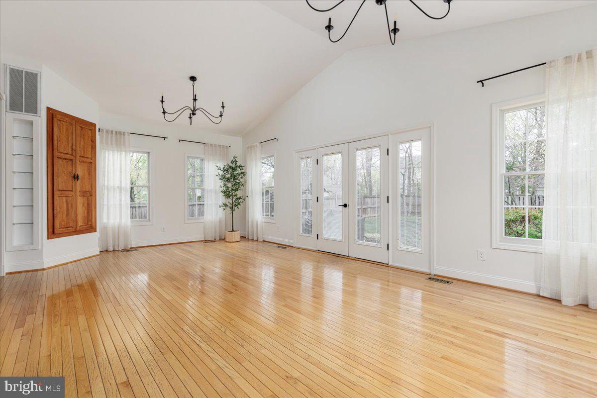 8747 Diamond Hill Drive Bristow, VA 20136 - Photo 11 of 38 a view of an empty room with wooden floor and windows