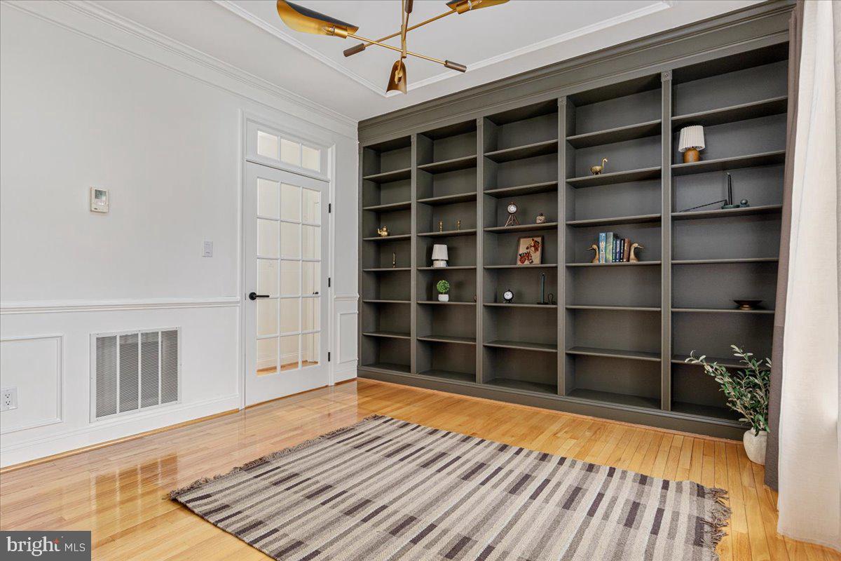8747 Diamond Hill Drive Bristow, VA 20136 - Photo 14 of 38 a view of a room with wooden floor and shelf