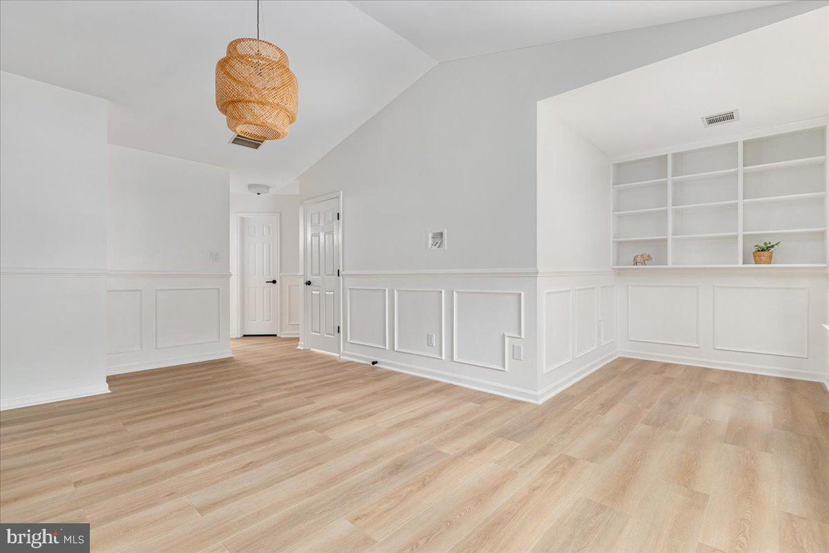 8747 Diamond Hill Drive Bristow, VA 20136 - Photo 19 of 38 a view of an empty room with a window and cabinets
