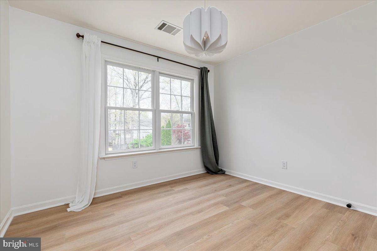 8747 Diamond Hill Drive Bristow, VA 20136 - Photo 26 of 38 wooden floor in an empty room with a window