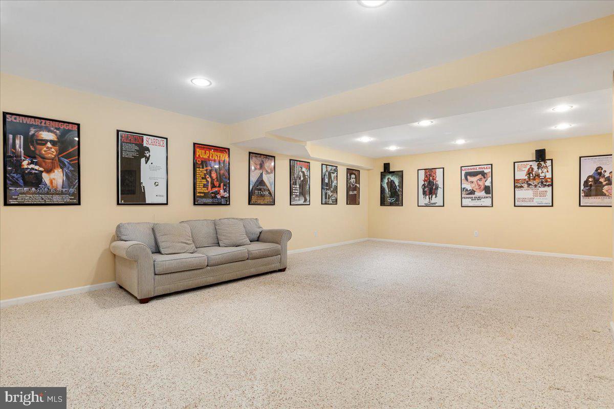 8747 Diamond Hill Drive Bristow, VA 20136 - Photo 30 of 38 a living room with furniture and a painting on the wall