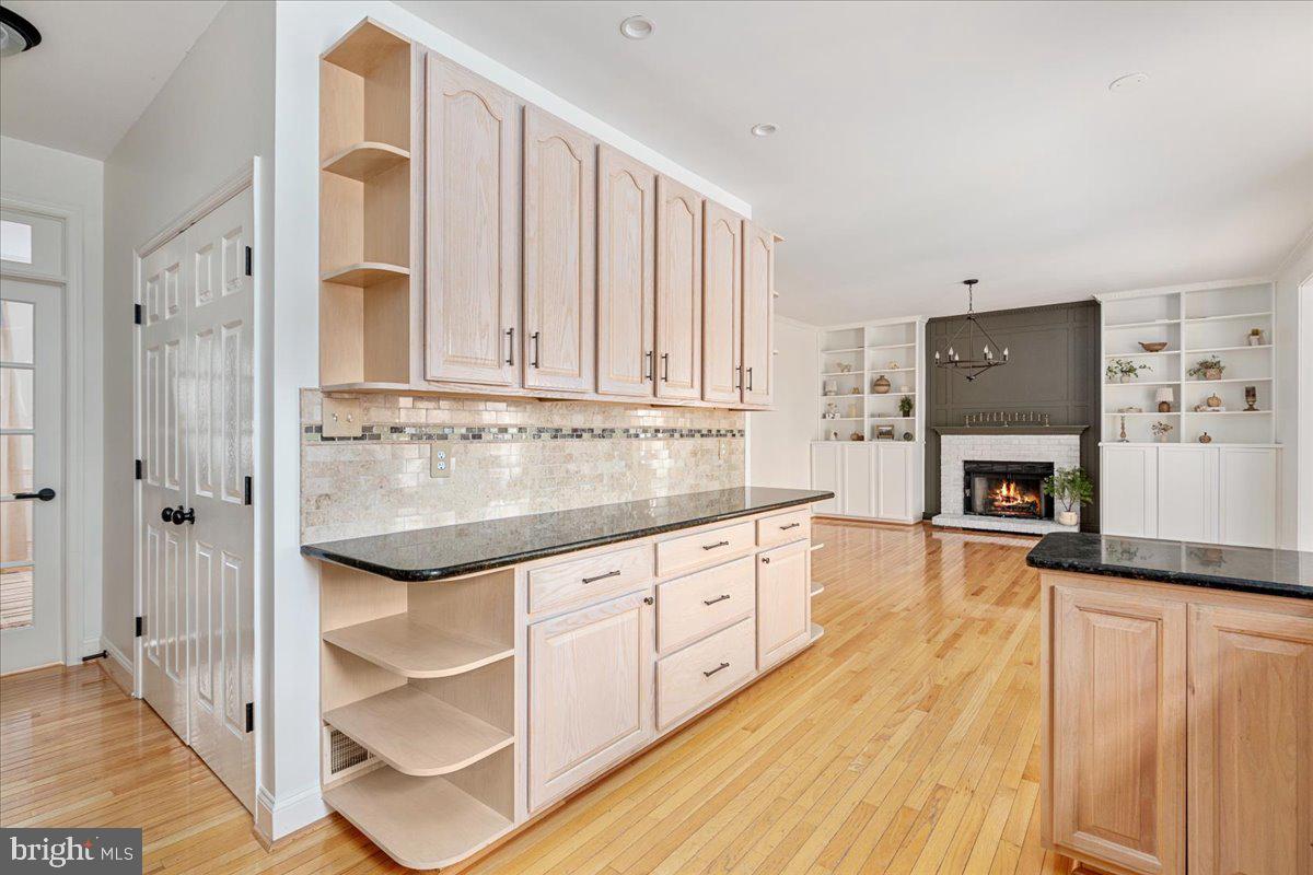 8747 Diamond Hill Drive Bristow, VA 20136 - Photo 6 of 38 a kitchen with stainless steel appliances granite countertop a stove a sink and a refrigerator