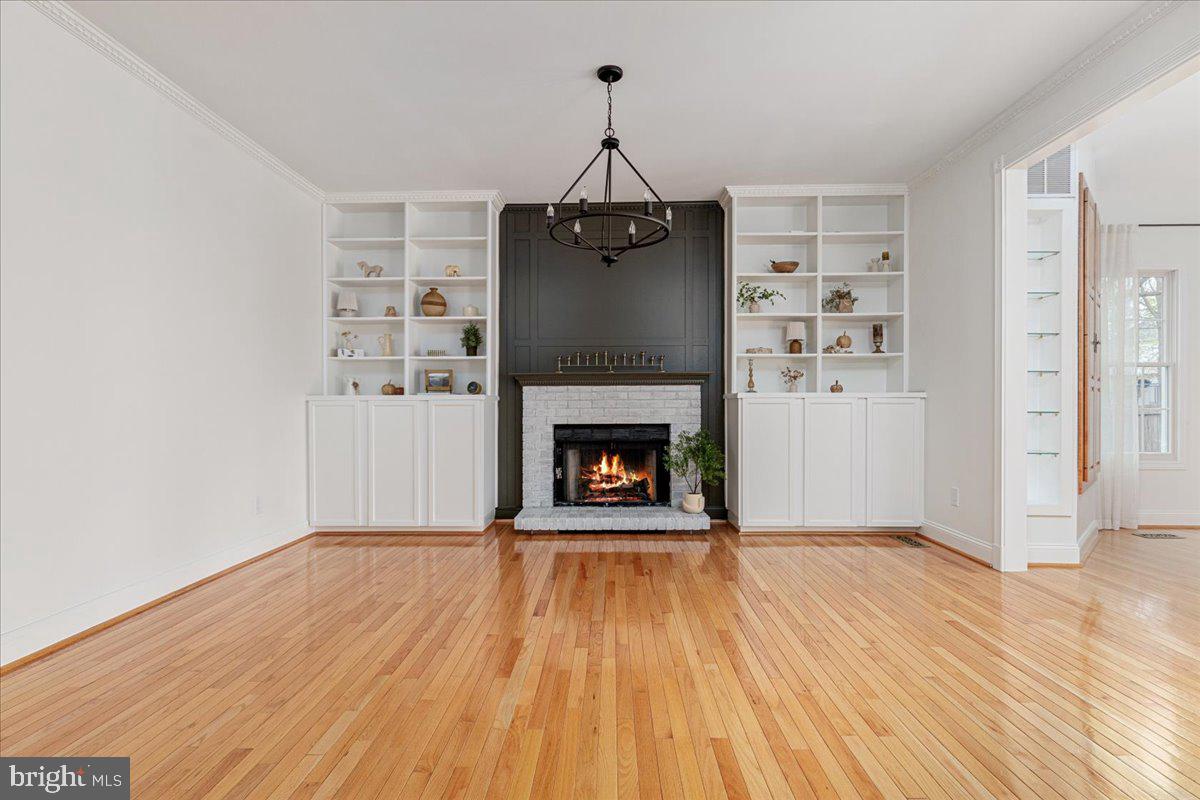 8747 Diamond Hill Drive Bristow, VA 20136 - Photo 7 of 38 a living room with a fireplace with wooden floor