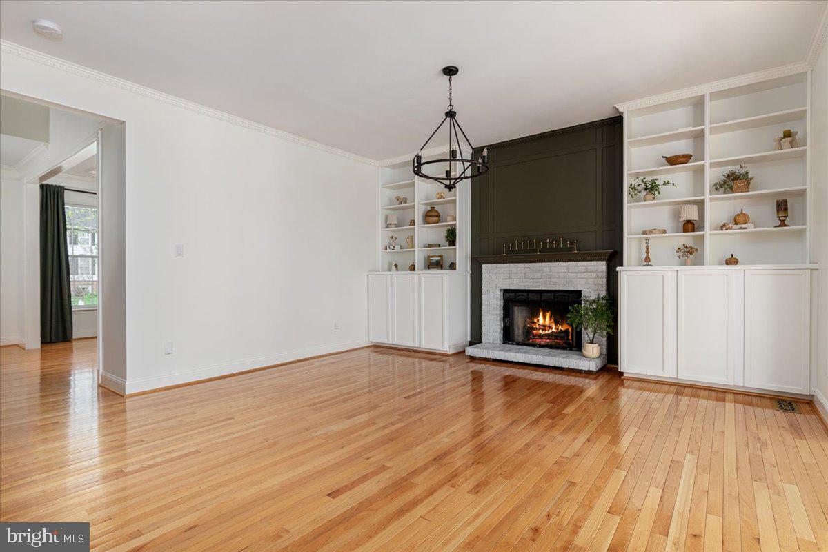 8747 Diamond Hill Drive Bristow, VA 20136 - Photo 8 of 38 a living room with a fireplace with wooden floor