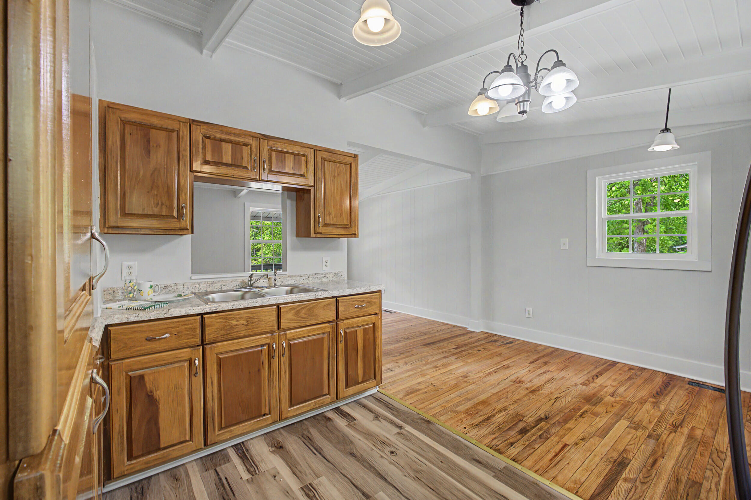 3016 Wagener Road Aiken, SC 29801 - Photo 14 of 29 a large kitchen with stainless steel appliances granite countertop a sink dishwasher and cabinets with wooden floor