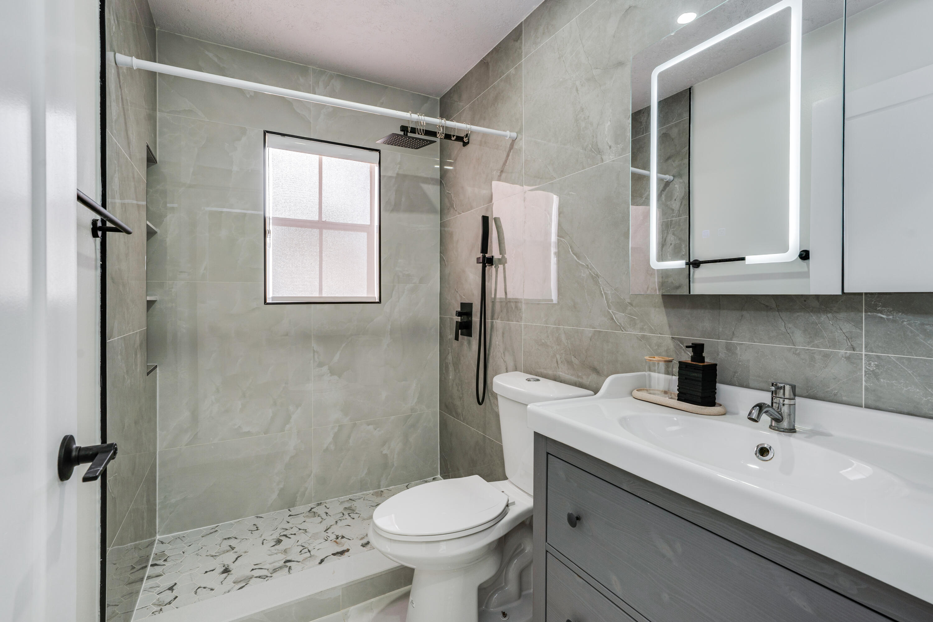 3084 Lighthouse Place Margate, FL 33063 - Photo 14 of 41 a bathroom with a sink toilet and shower
