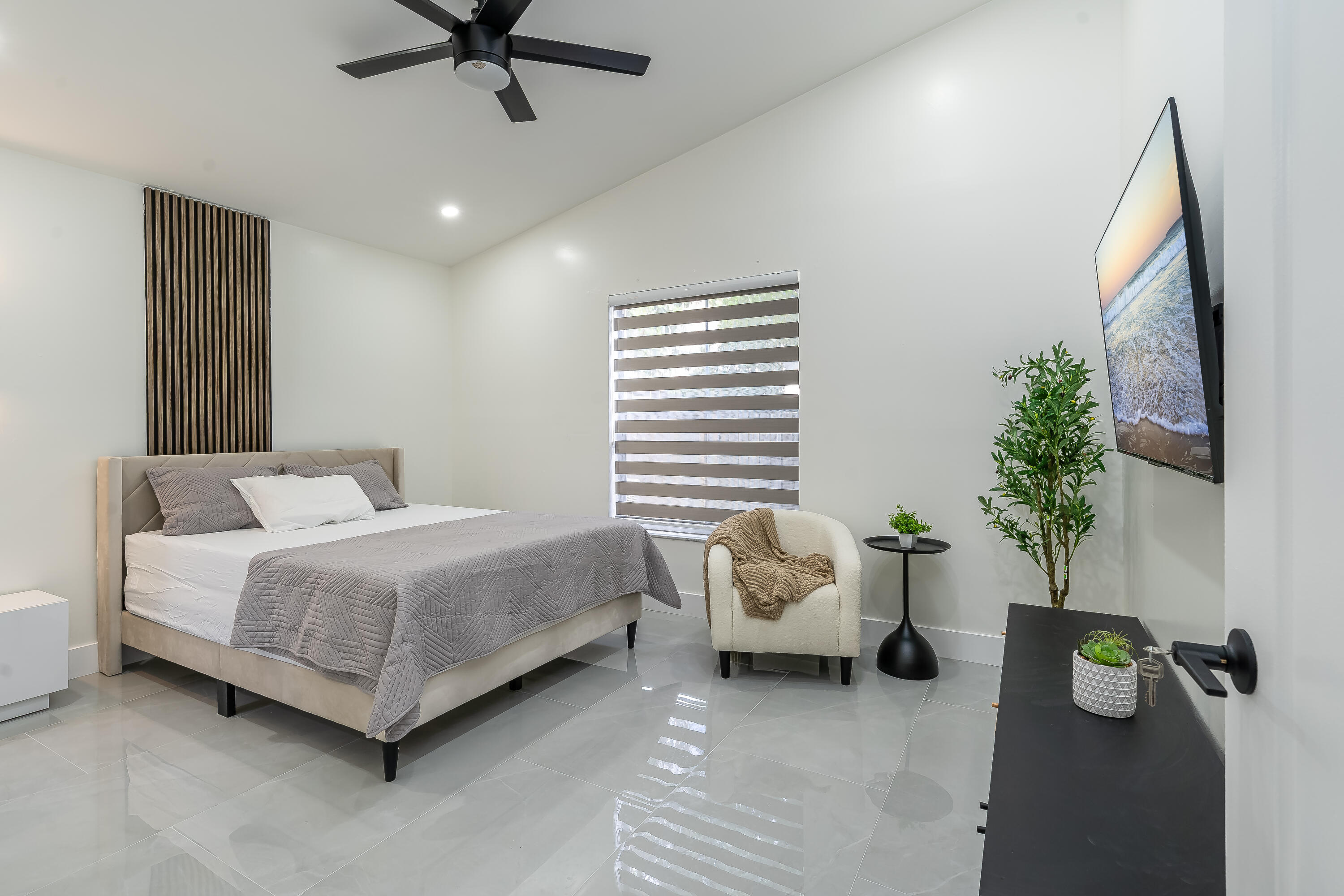 3084 Lighthouse Place Margate, FL 33063 - Photo 17 of 41 a spacious bedroom with a bed and a window