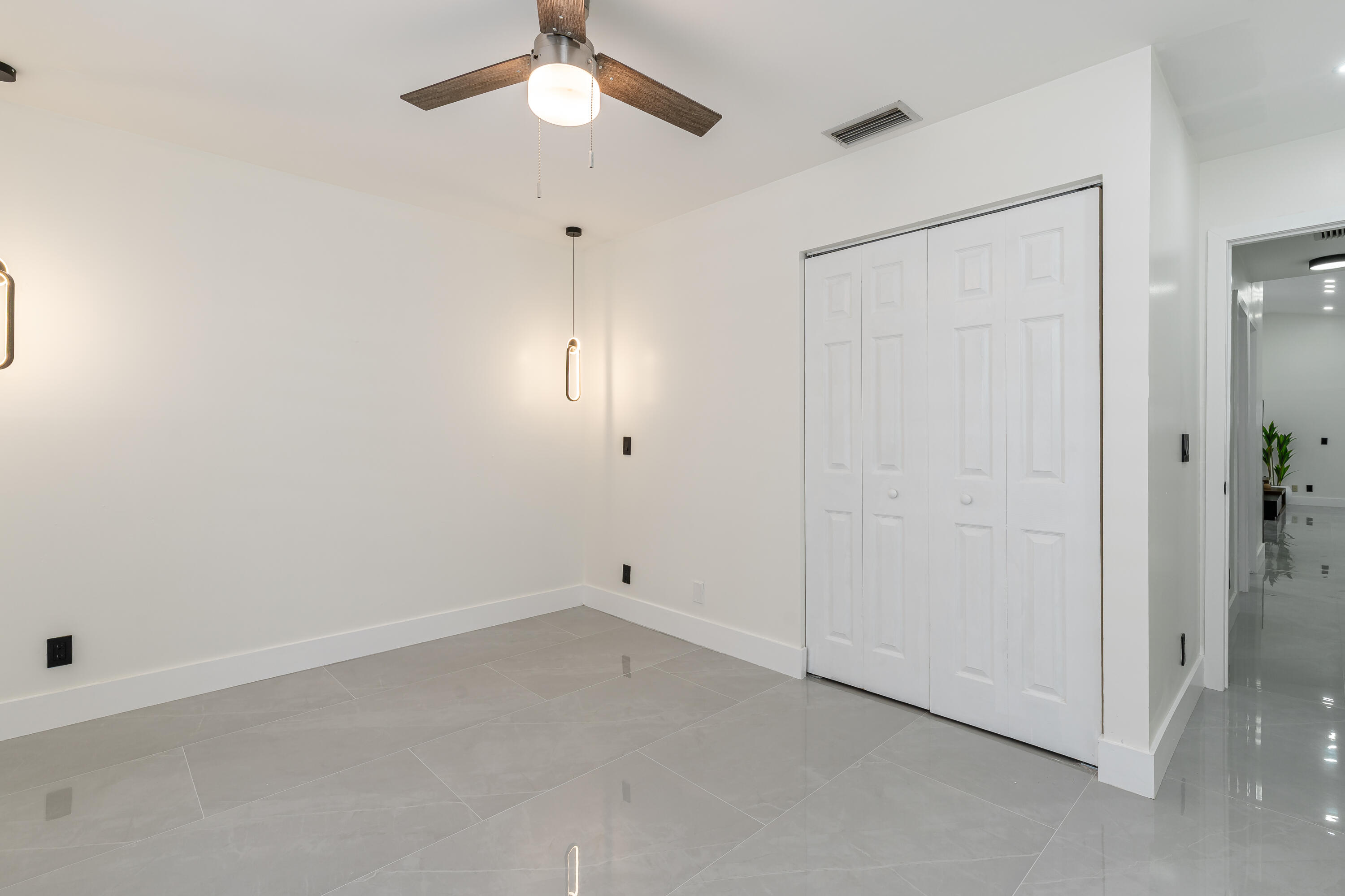 3084 Lighthouse Place Margate, FL 33063 - Photo 21 of 41 an empty room with fan