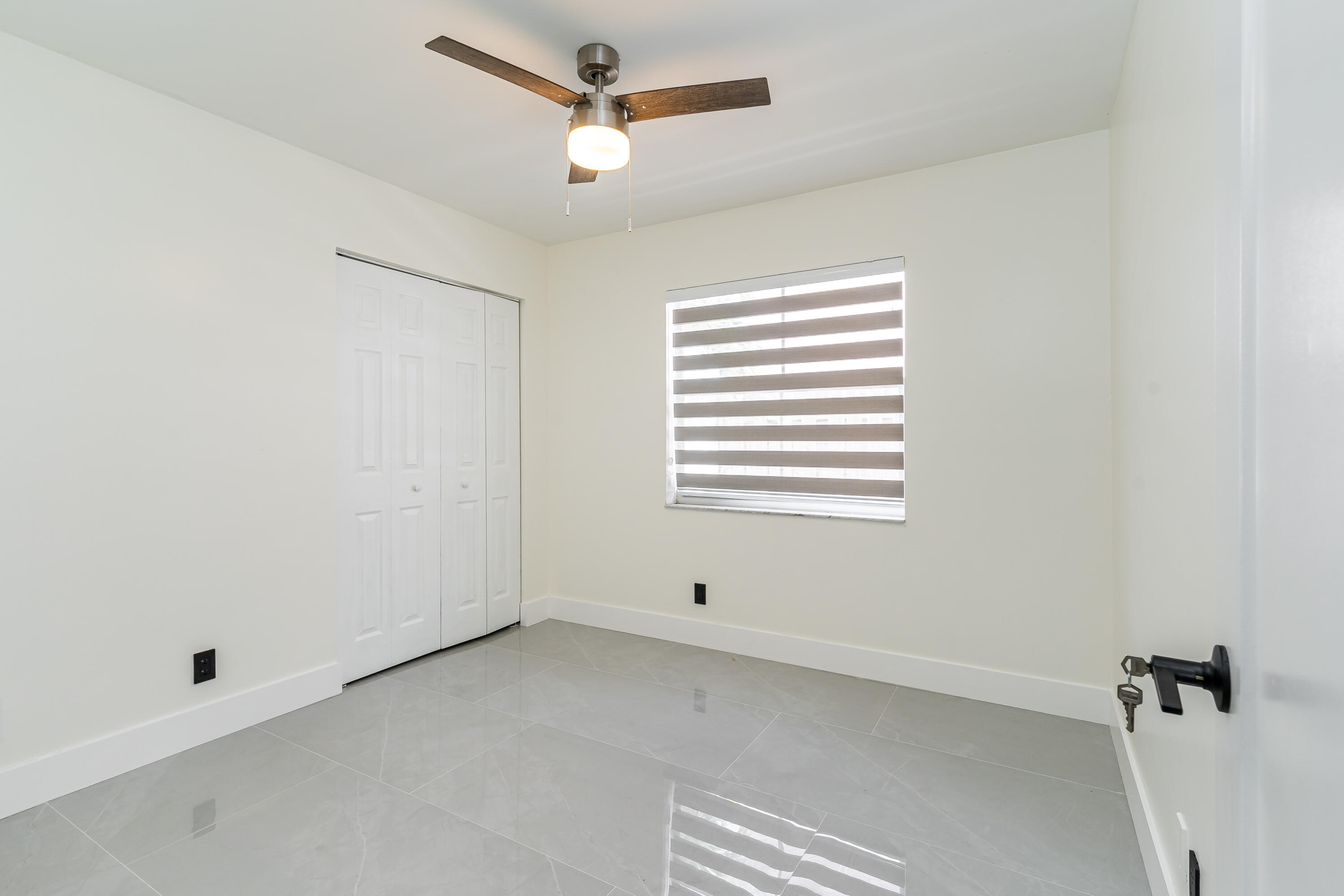 3084 Lighthouse Place Margate, FL 33063 - Photo 23 of 41 a view of an empty room with a window