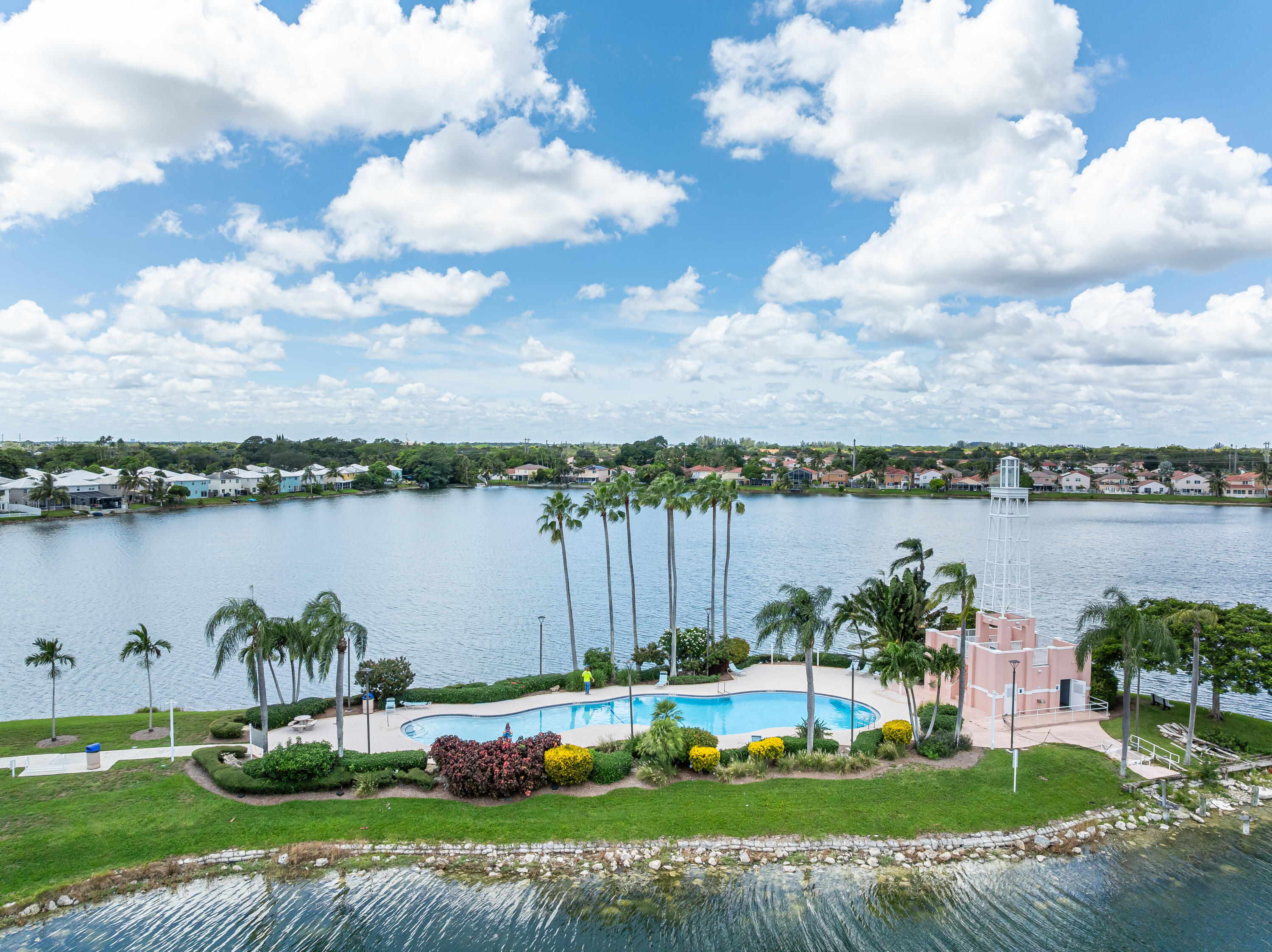 3084 Lighthouse Place Margate, FL 33063 - Photo 33 of 41 a view of a lake with a big yard and potted plants