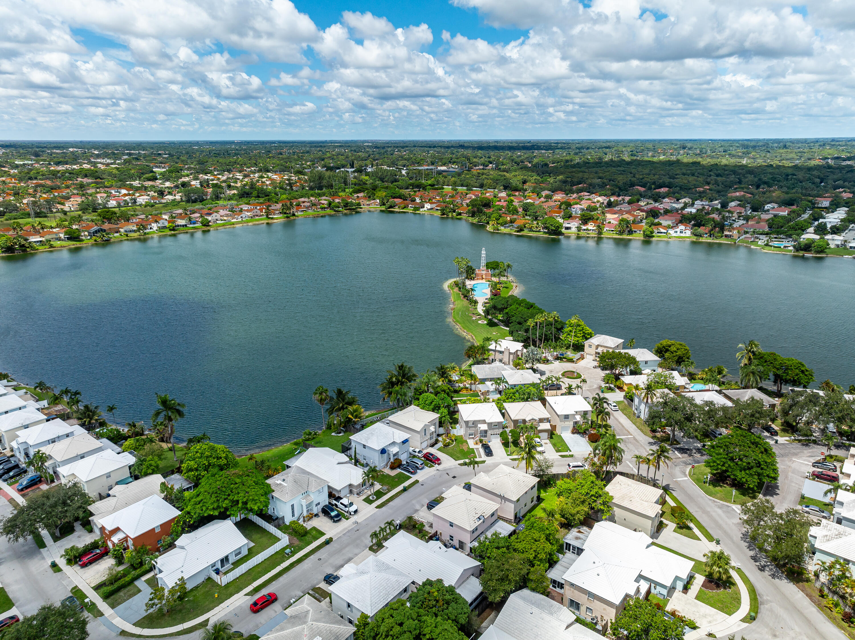 3084 Lighthouse Place Margate, FL 33063 - Photo 37 of 41 an aerial view of a city with lots of residential buildings lake and ocean view