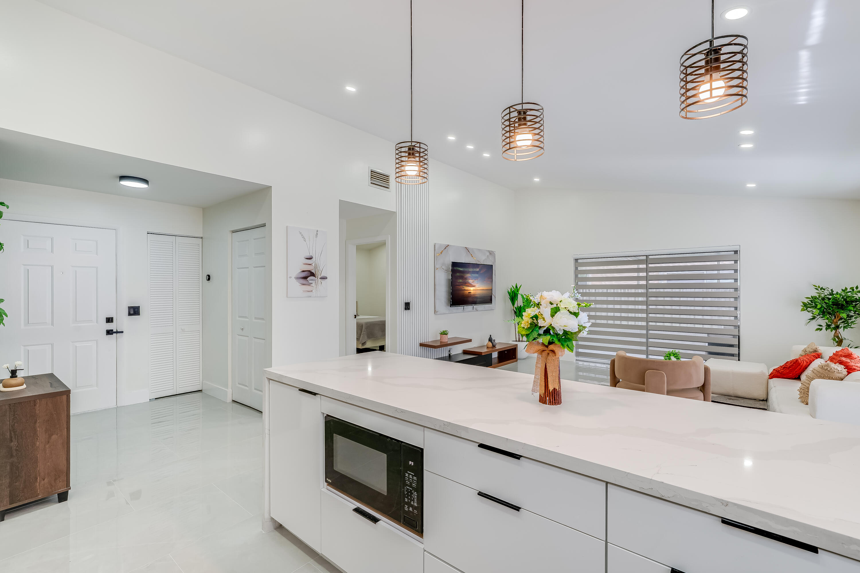 3084 Lighthouse Place Margate, FL 33063 - Photo 10 of 41 a view of a kitchen with a sink and chandelier