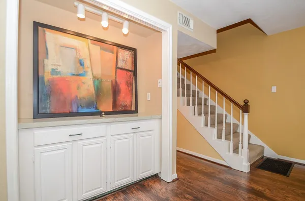 a view of an entryway with wooden floor