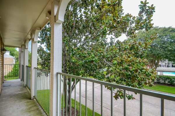 a view of a balcony with an outdoor space